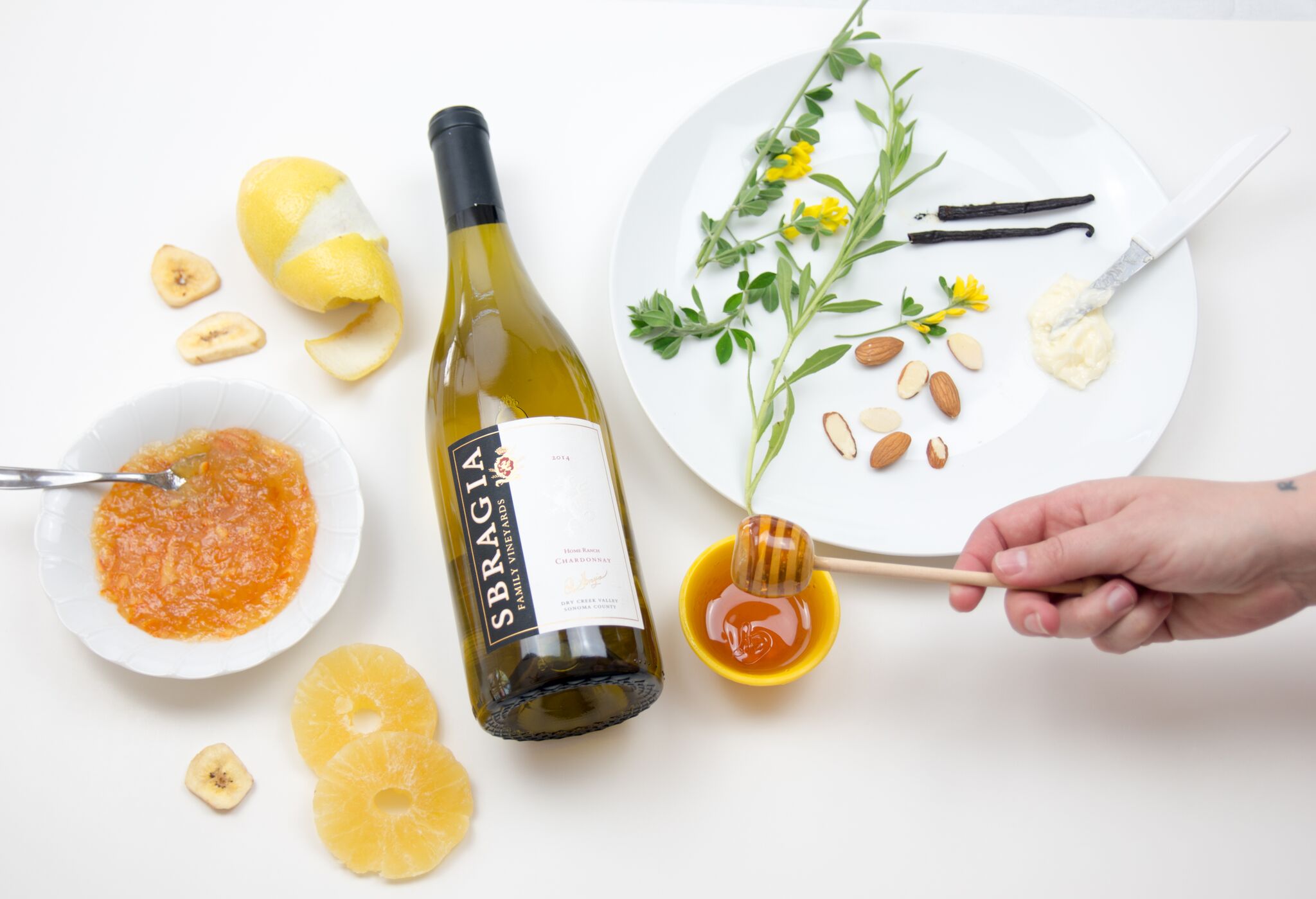 What's in the Bottle Photo featuring Sbragia Chardonnay and typicall chardonnay flavor visuals like lemon, honey, butter and orange marmalade